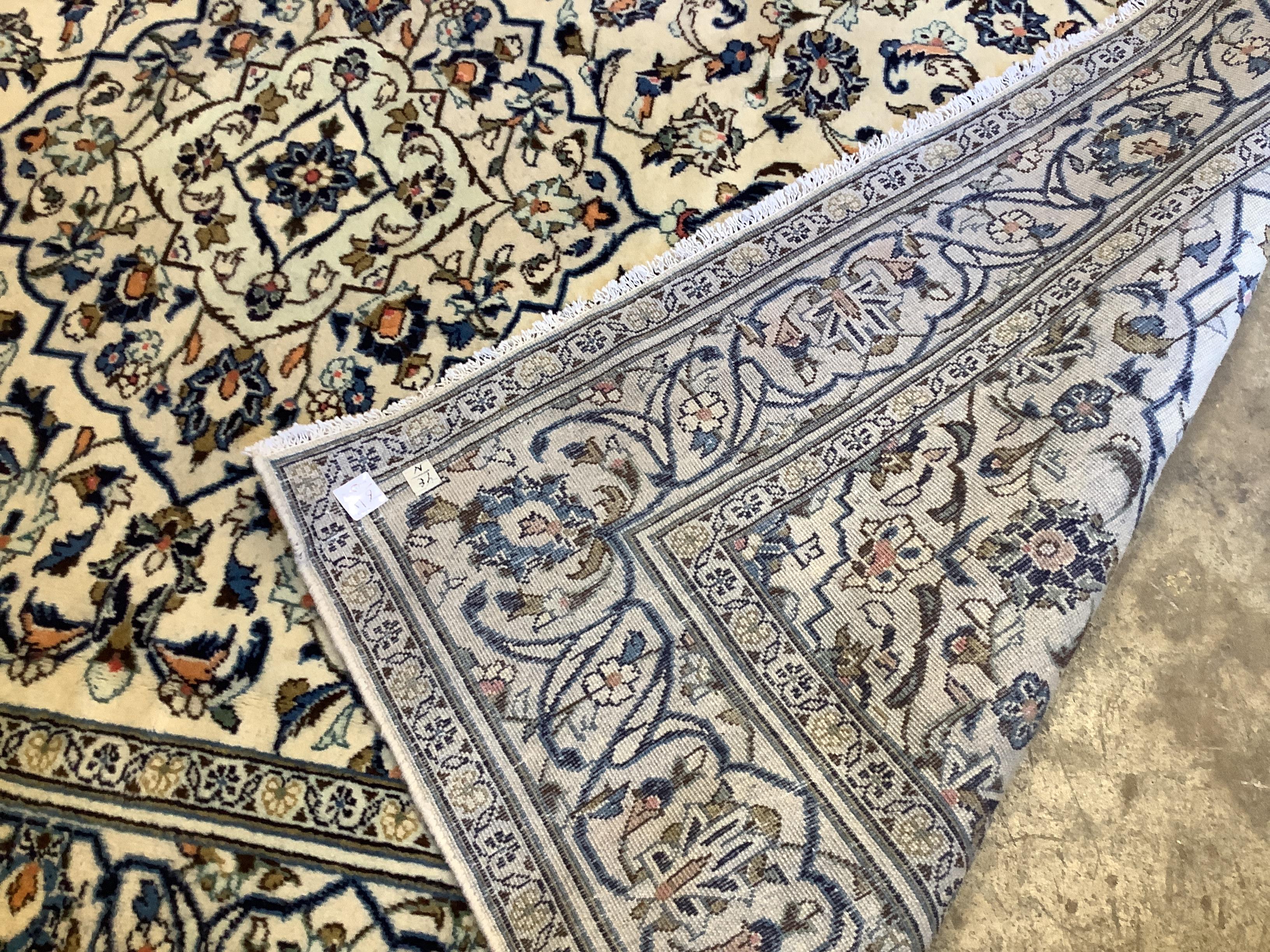 An Araan ivory ground carpet, 292 x 196cm
